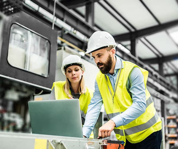 Woman and man industrial setting